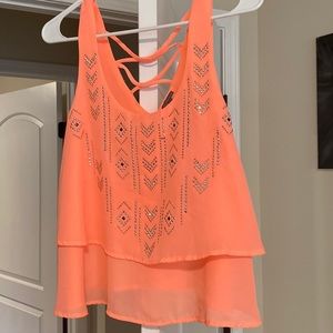 Charlotte Russe bright coral/pink tank top w/ silver studs and criss cross back.